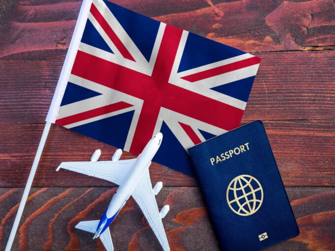British flag, passport and an aeroplane.
