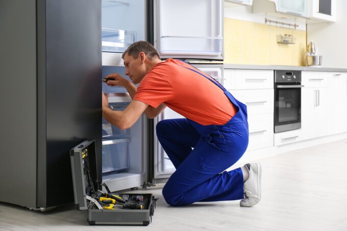 Refrigerator Repair. Concept for Appliances Maintenance and Repairs.