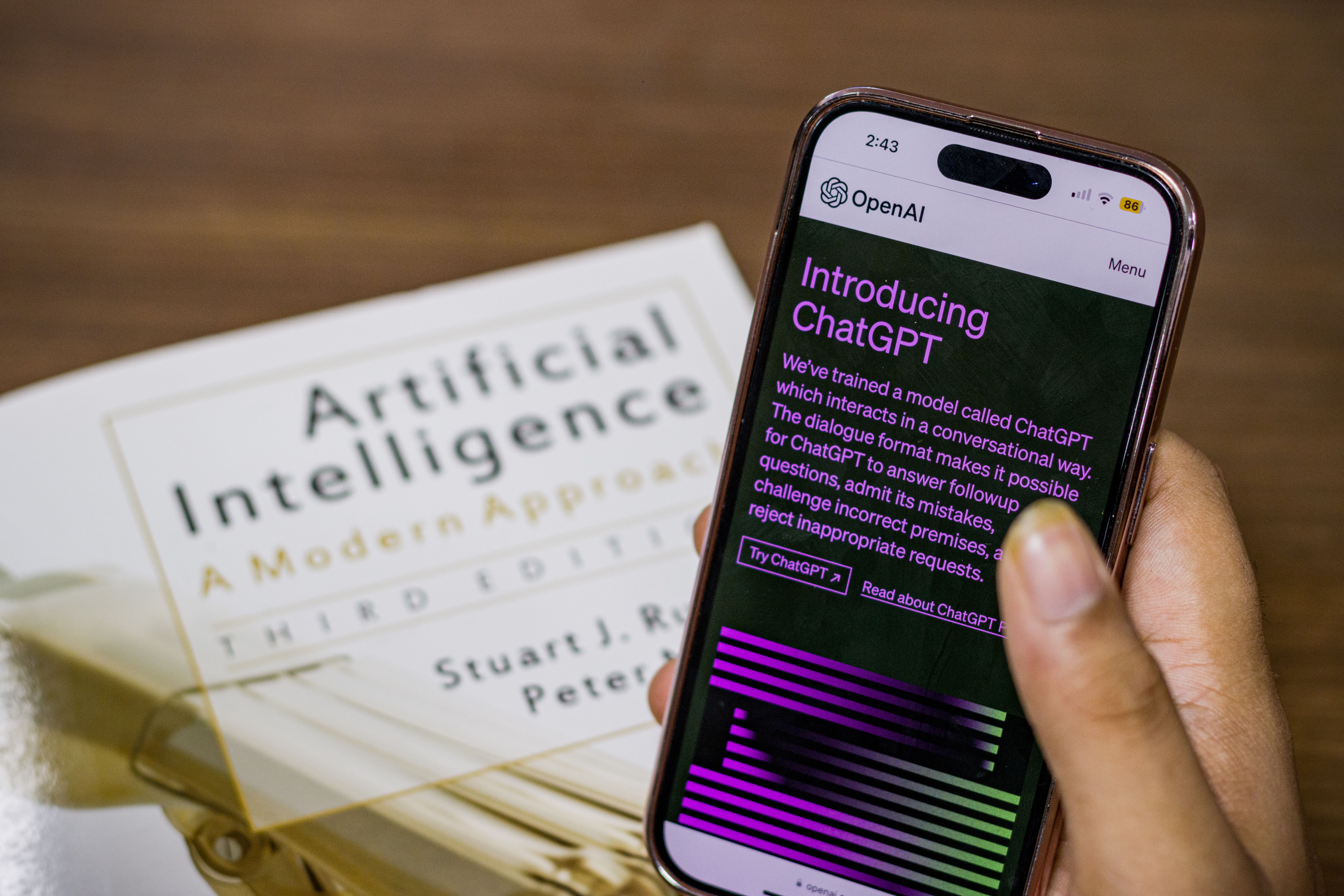 Close-up of a smartphone displaying an AI chat interface, representing an artificial companion.